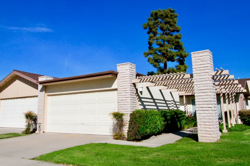 the terreace which has the lane in front of it with a tree in villa pacific of huntington beach california