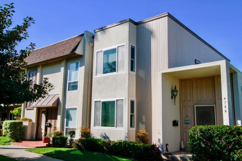 the own house with huge door in front of it in villa pacifica of huntington beach california