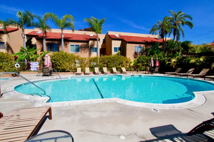 the villa st. crolix the house infornt swimming pool and around tree is nice in huntington beach in ca