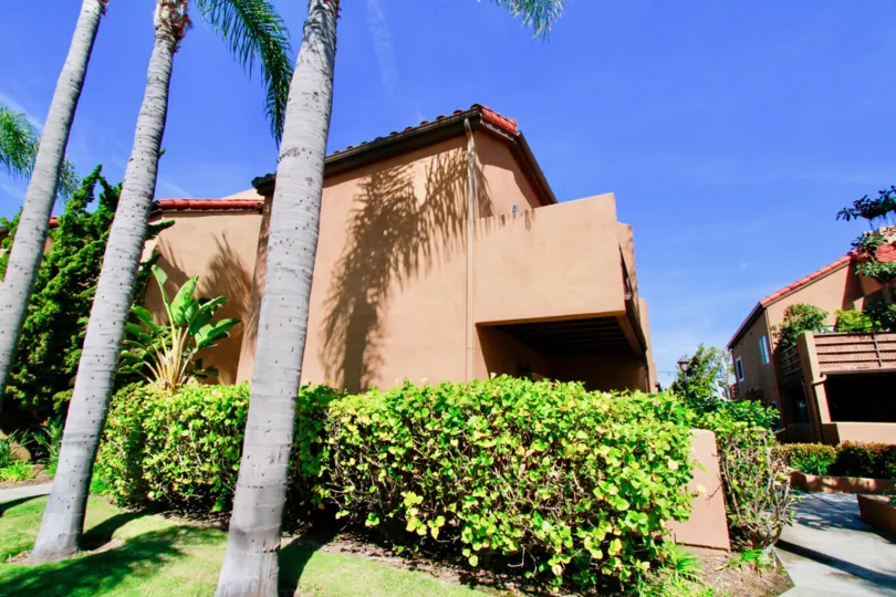 the pink colored house in villa st. croix which has lot of trees in hungtington beach california