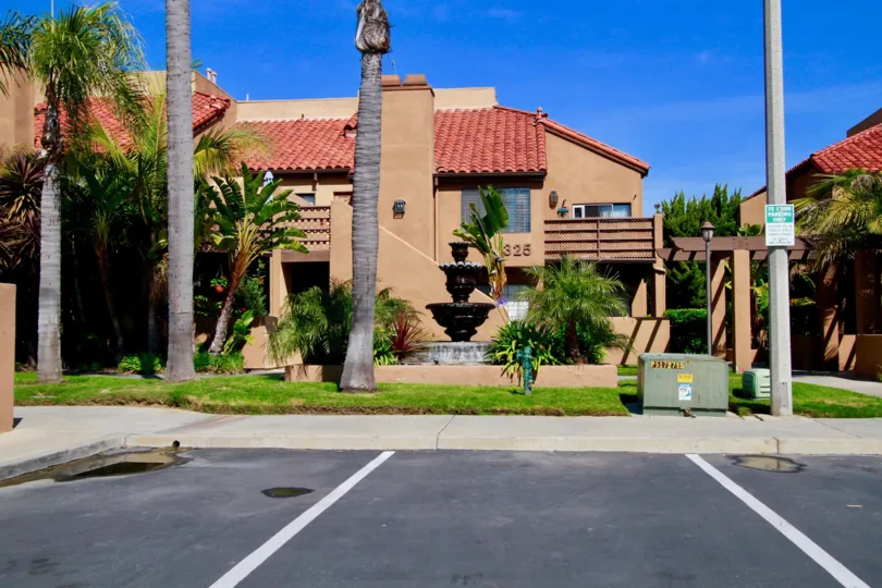 Colourful approach of Villas with road point and trees in Villa St. Croix of Huntington Beach