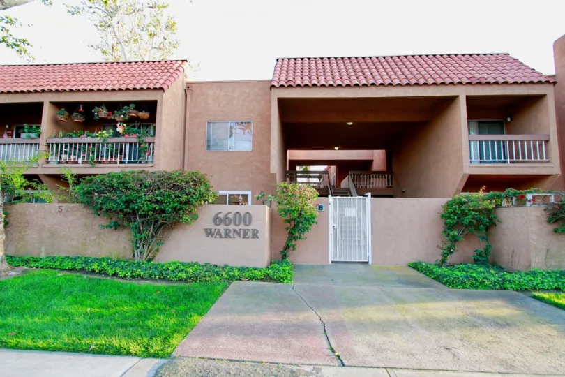Villa Warner Huntington Beach California house color brown color gate white color balcony attached sequare type house