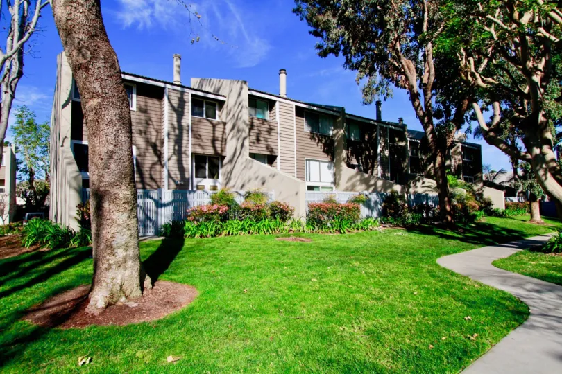 Village Court Huntington Beach California building is brown color paint apply glass window attached top floor long pipe attached