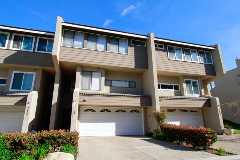 THE BUILDING WITH TWO FLOORS AND SOME BEAUTIFUL FLOWERS PLANTS AT BOTH SIDE OF THE HOUSE AND A ROAD PATH ALSO AVAILABLE.