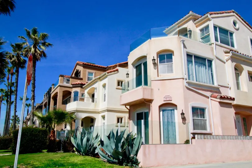 Vista Catalina apartments with balconies and a fence on a sunny day.