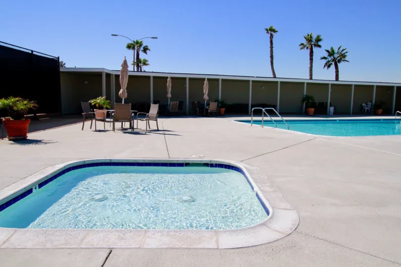 Weatherly Bay Huntington Beach California building brown paint two swmming pool bench water attached