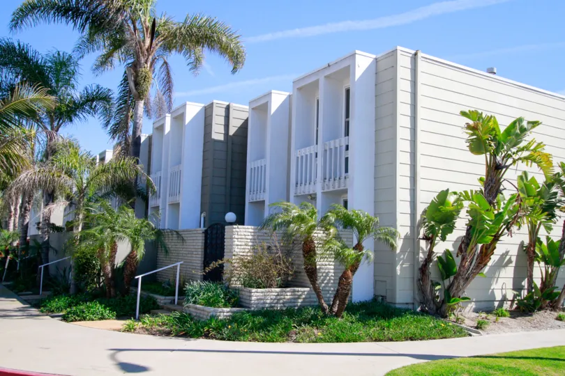 Weatherly Bay Huntington Beach California building big size paint color light biscuts and white box type house balcony and glass attached