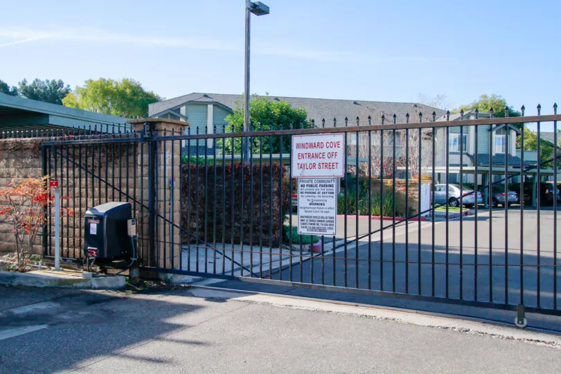 A sunny day in the Windward Cove with huge fontgate and car parking.