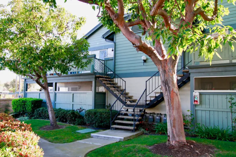 Windward Cove Huntington Beach California building color light green steps attached in front place groun floor some place white paint