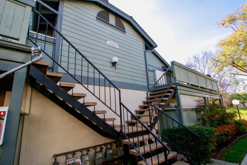 the farm house which has the lot of step in front of it which is in windward cove of huntington beach, california