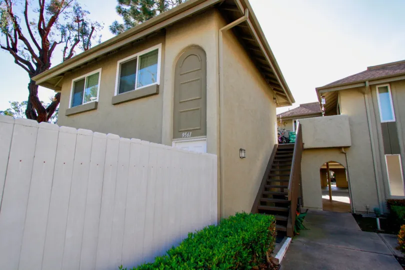 Yorktown Villas Huntington Beach California building is very super biscuts color paint apply glass window attached side steps coverded backside tree