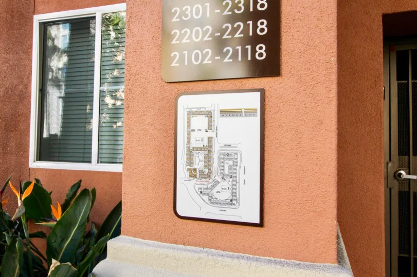 a warm day in the avenue on with building that has numbered as 2301 2318, 2202 2218, 2102 2118