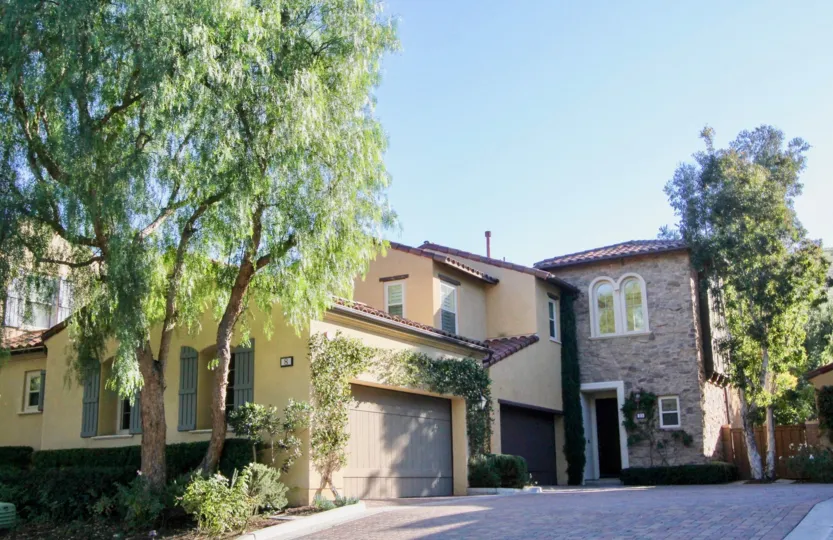 THE ENTRANCE WAY TO THE VILLA WITH SHED, LOT OF TREES, PLANTS WHICH IS SITUATED IN IRVINE CITY