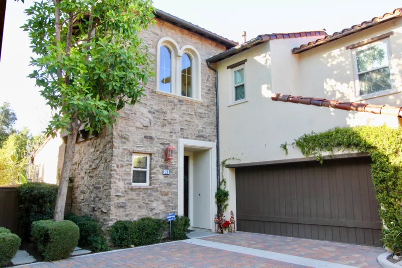 A two-storey residence in the Canyon's Edge community clad in stone.