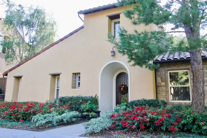 a warm day in the canyon's edge with house that has roofless top and garden around and door decerated