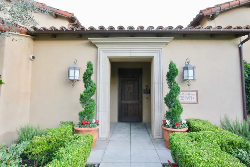 This three bedroom, two and a half bathroom home has hardwood floors throughout the kitchen and dining areas,