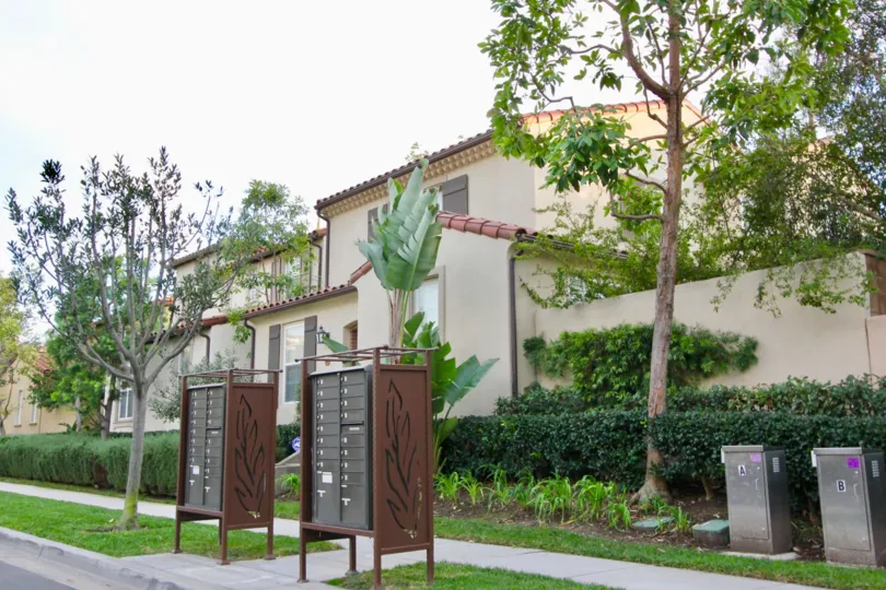 THIS IS THE SIDEVIEW OF THE HOME WITH LAWN, PLANTS, TREES WHICH IS LOCATED IN CHANTORY COMMUNITY