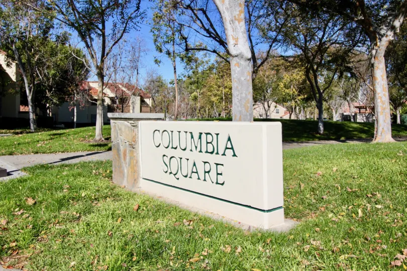 Nice park area with trees near villas in Columbia Square of Irvine