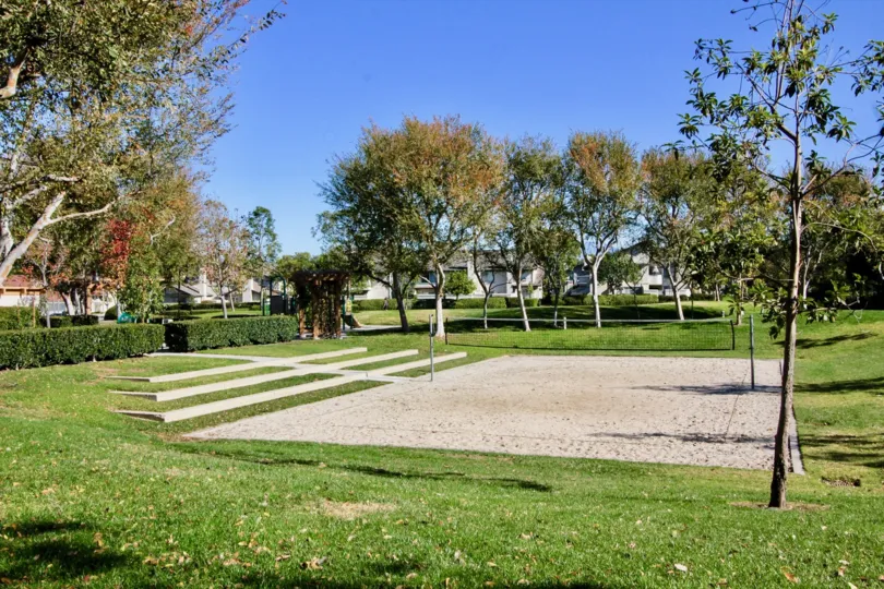 THIS SHOWS THE GARDEN WITH BEAUTIFUL LAWN, MANY TREES, PLANTS WHICH IS LOCATED IN IRVINE CITY