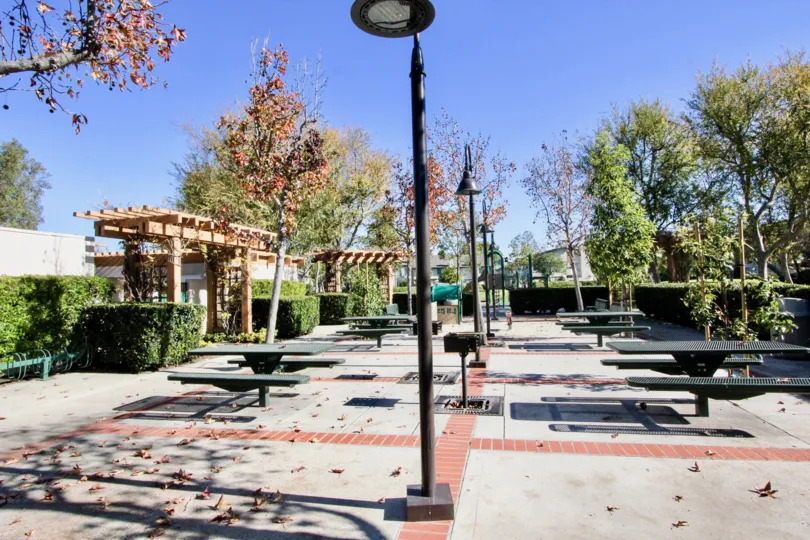 The Place in Columbia Square has Dinning tables, Street lamps with plants and trees