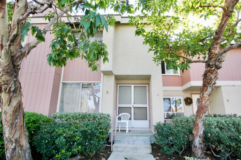 THE 4TH FLAT IN THE DEERFIELD TOWNHOMES WITH THE CHAIR, PLANTS, UPSTAIRS