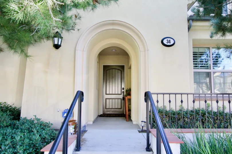 A house with massive entrance with many balcony and garden in Four Quartets irvine, California