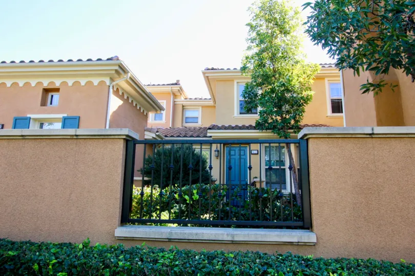 THIS IMAGE REPRESENTS THE HOME WITH PLANTS, AND TREES WHICH IS IN THE IRVINE CITY