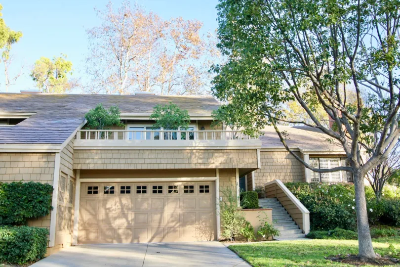 A modern brick home with a downward slope style front inside Glen Garden Homes located in Irvine CA