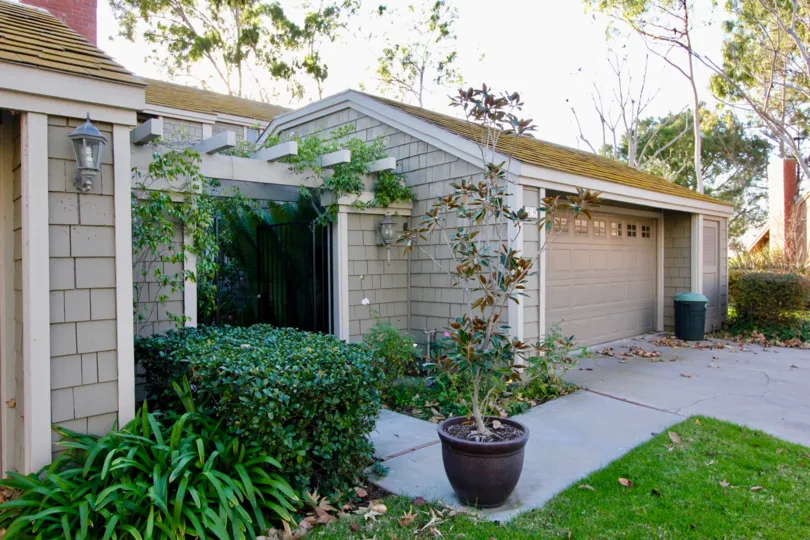 THE ENTRANCE WAY TO THE HOME WITH SHED GARDEN LIKE PLANTS ARE THERE IN THE CITY OF IRVINE