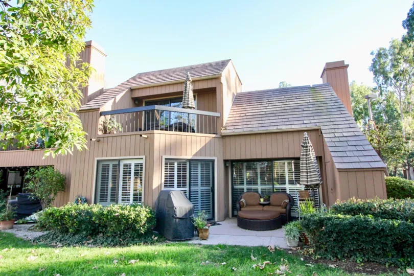 a pleasant day in the glen town homes with house that has sitting sofa and garden around