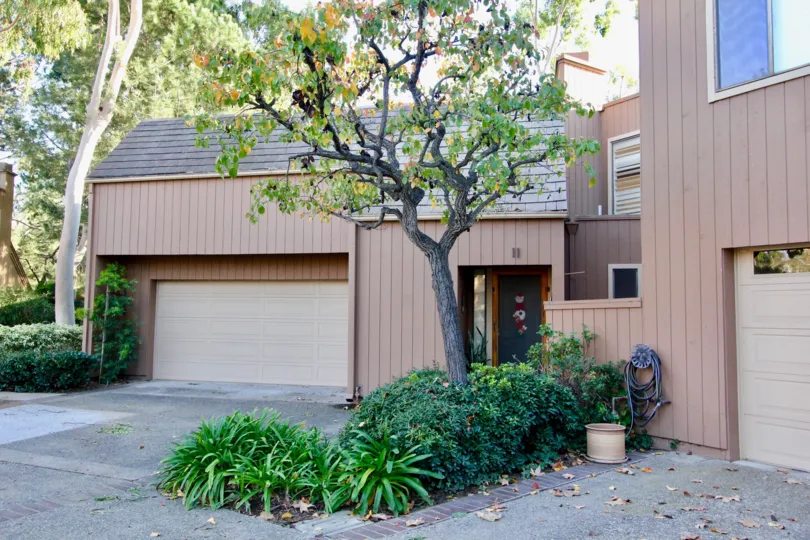 THE HOUSE IN THE GLEN TOWNHOMES WITH THE SHUTTER, PLANTS, TREES