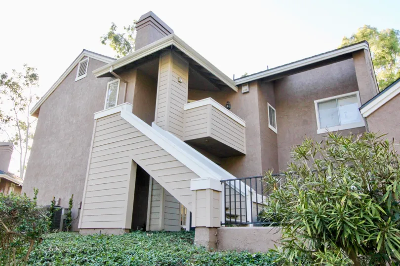 Nice sky view of villa with upstairs and balcony having small garden in Highland View of Irvine