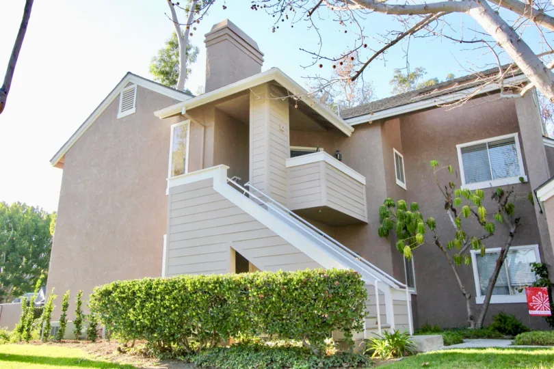 A large staircase attached to a two story housing structure at Highland View in Irvine CA