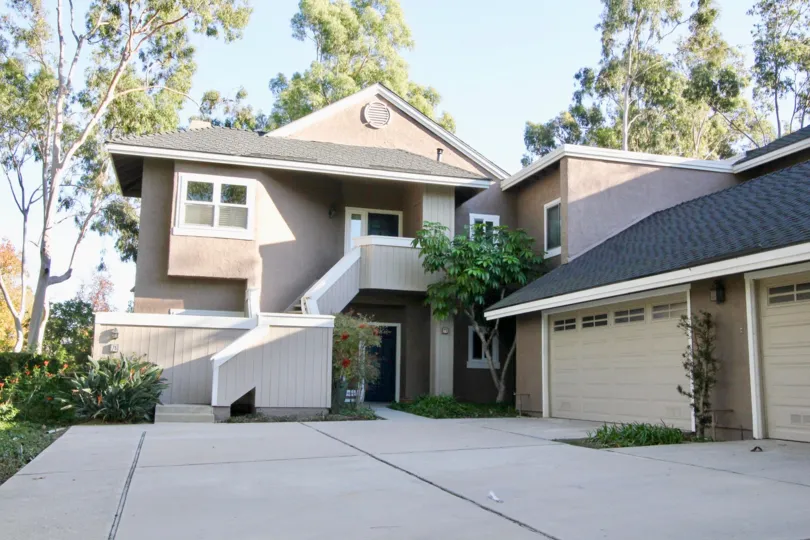 THE FRONT VIEW OF THE HOUSE EMPTY SPACE IN FRONT SIDE, BACKSIDE LOT OF TREES ARE THERE IN IRVINE CITY