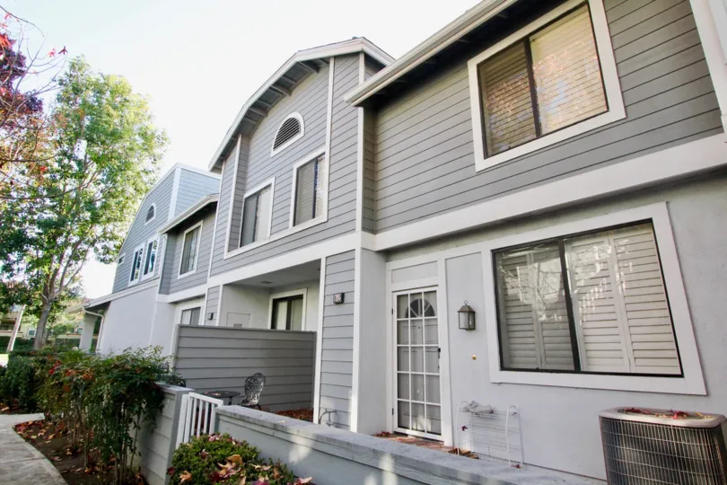 A gray two story apartment complex inside the Horizon in Irvine California