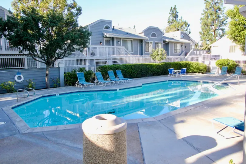 Nice view of swimming pool and trees near villas with sitout of Horizon in Irvine