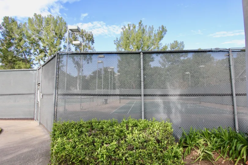 THIS SHOWS THE SWIMMINGPOOL SURROUNDED THE GATE, PLANTS AND TREES ARE SHOWN IN THE CITY OF IRVINE