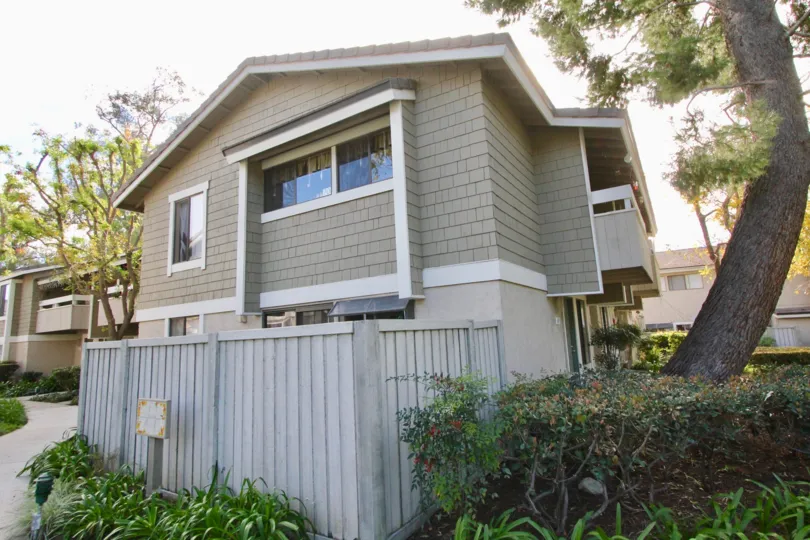 THE GREY COLOUR HOUSE WITH PLANTS, TREES WHICH IS LOCATED IN IRVINE CITY