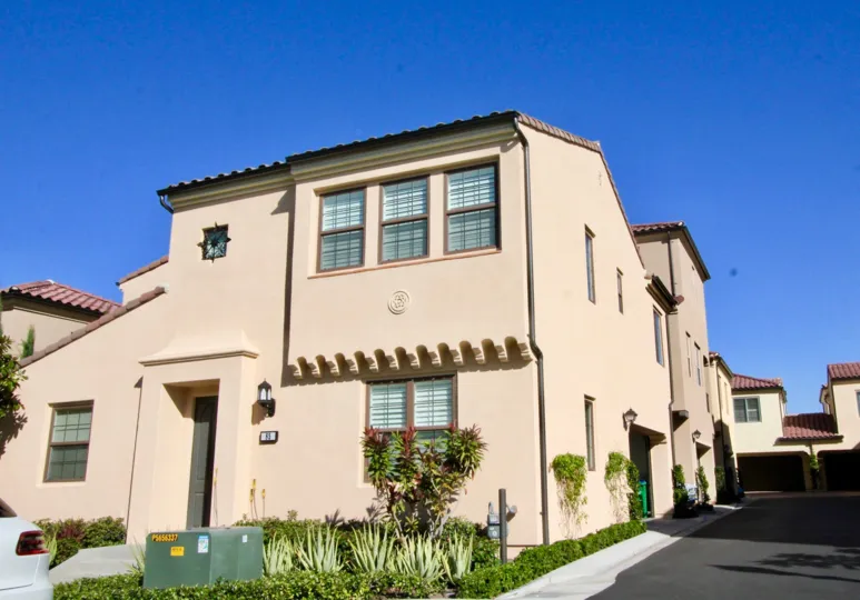 At sunny day of Jade court, 85th villa has postal boxes between the bushes
