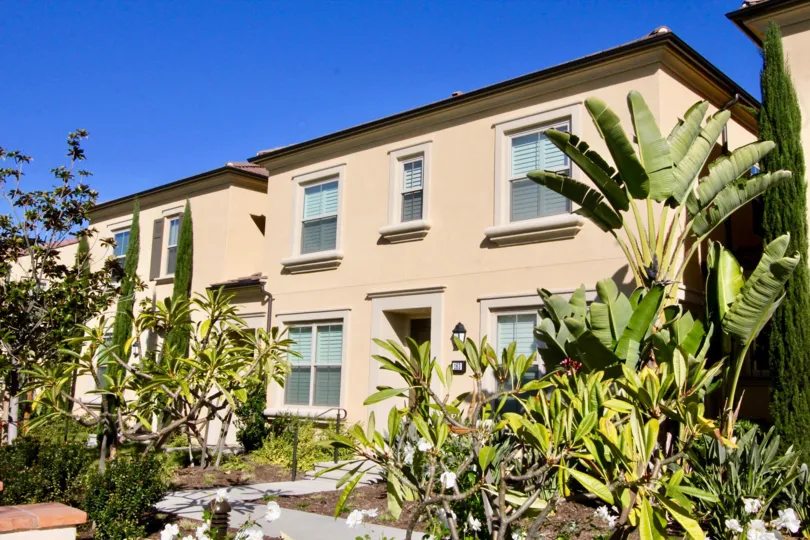 a warm day in the jade court with a building that has roofless top and garden around