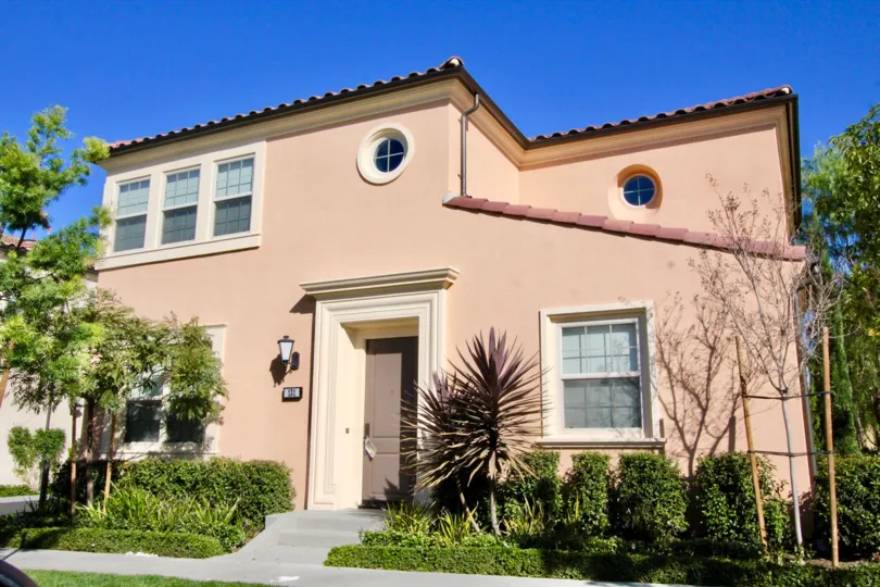 A two-storey residence in Jade Court community with round windows.