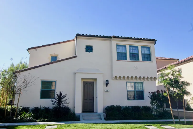 THE HOUSE WITH LOT OF PLANTS AND TREES IS IN IRVINE CITY