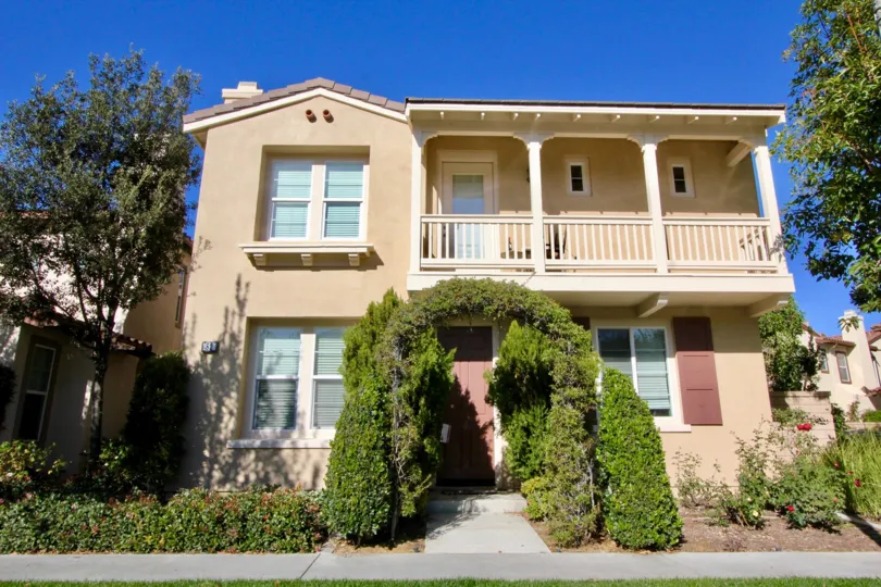 A sunny day at a two-story house in the Lauerel Quail Hill Community in Irvine California.