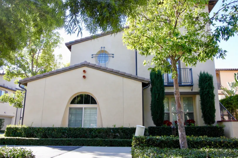 The Villa in Lombard Court has trees with bushes at front of entrance
