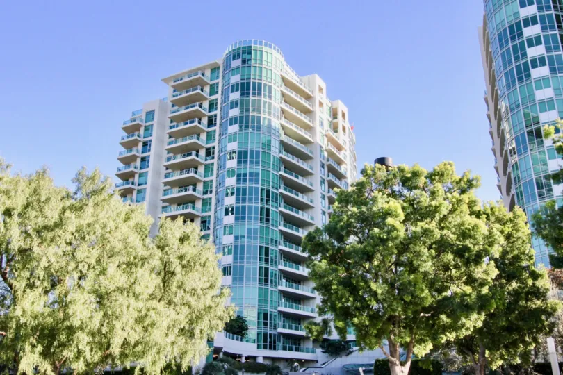 a warm day in the marquee at park place with a building that has two trees in front and tall building