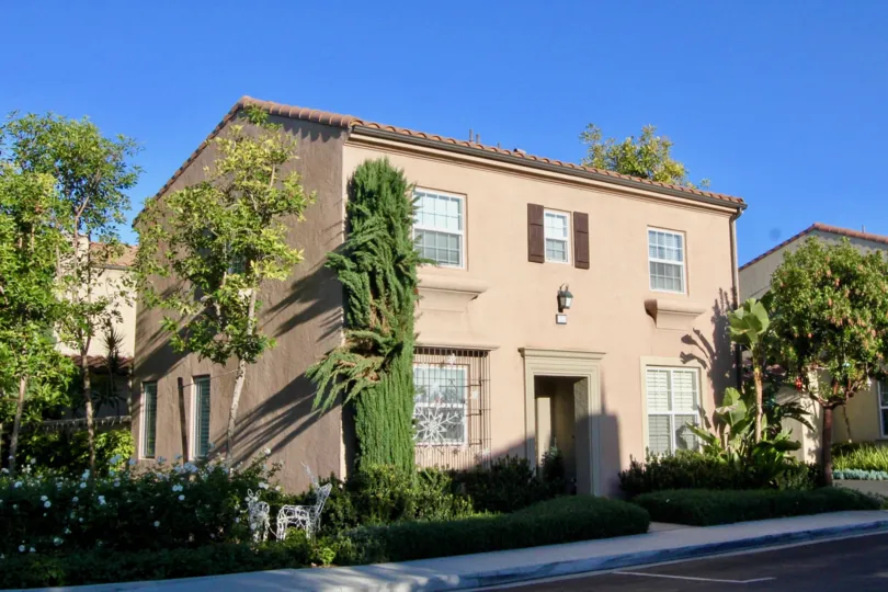 THE HOME WITH PLANTS, TREES AND THE PATHWAY SHOWN IN THE IMAGE IN IRVINE CITY
