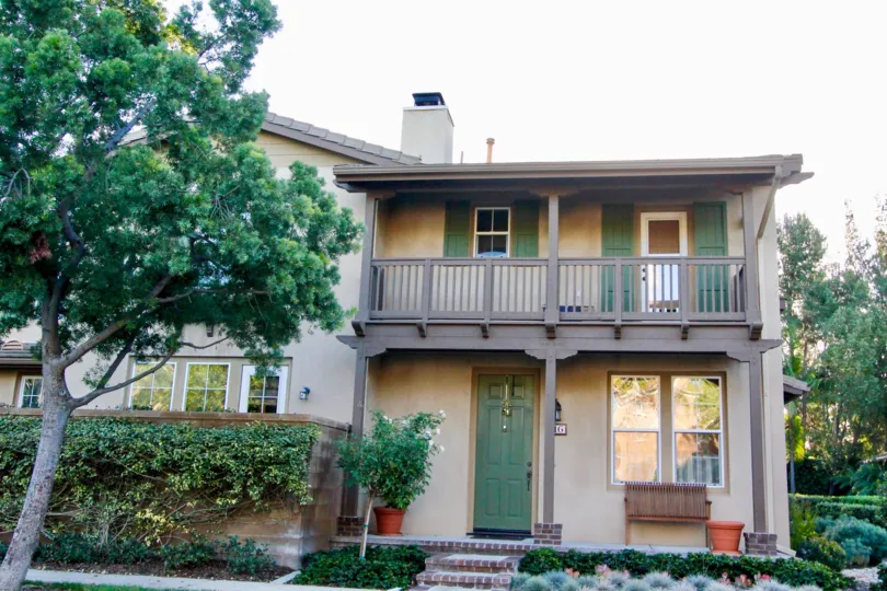 The front entrance of a home in Northpark Square in Irvine on a sunny day featuring the landscaping