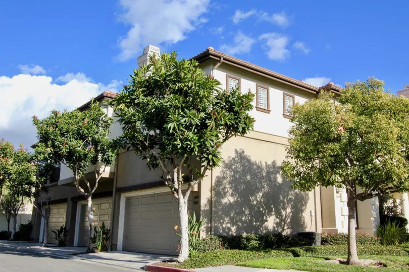 Bright sunshine near villa with trees in Northwood Pointe of Irvine
