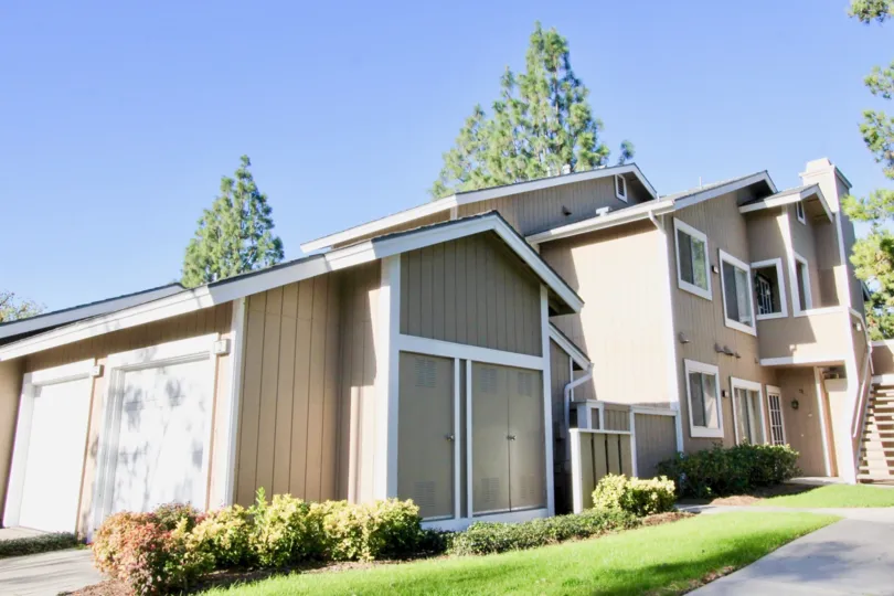 Tan paneling and white trim cover a condo building at Northwood Timberline.