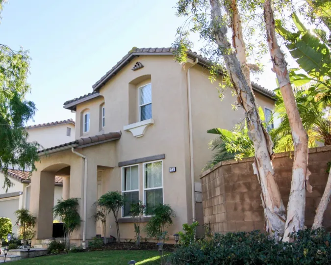 A brick fence extending from an Oak Creek house in Irvine, California.